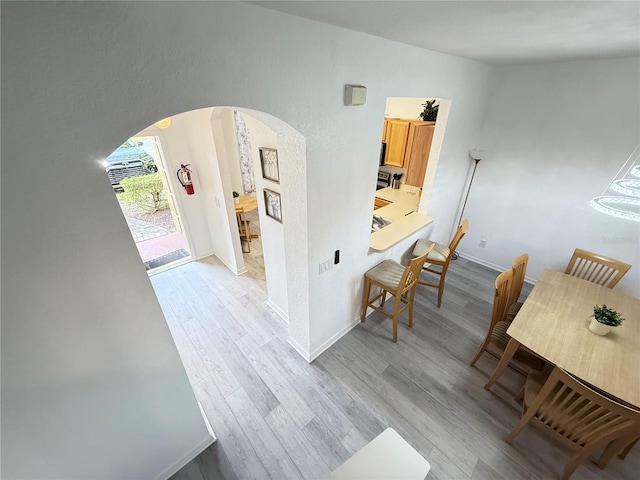 615 Terra Lago St, Davenport, FL 33897 - hall with arched walkways and wood finished floors