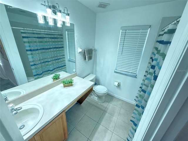 615 Terra Lago St, Davenport, FL 33897 - bathroom with tile patterned floors, vanity, and a shower with curtain