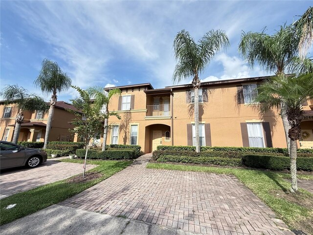 324 Palermo St, Davenport, FL 33897 - mediterranean / spanish-style house with stucco siding and a balcony