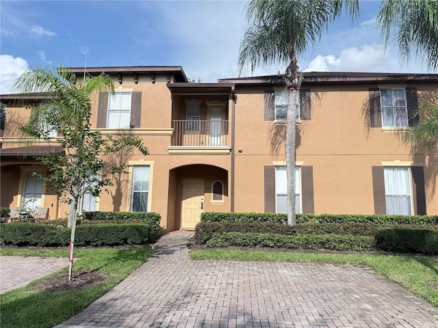 324 Palermo St, Davenport, FL 33897 - view of front of property with stucco siding and a balcony