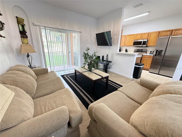 324 Palermo St, Davenport, FL 33897 - living room with light tile patterned floors and baseboards