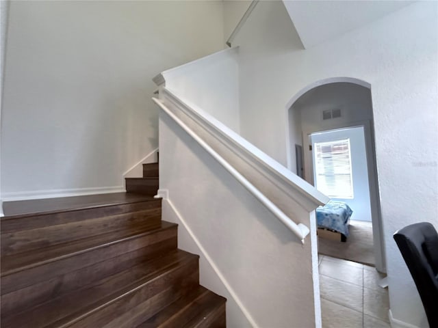324 Palermo St, Davenport, FL 33897 - stairway featuring arched walkways and tile patterned flooring