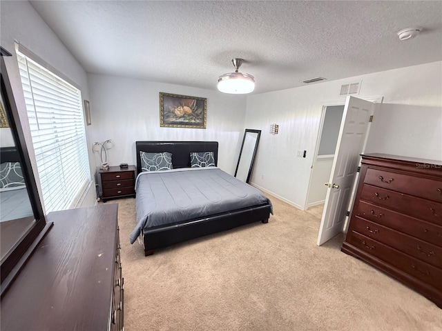 324 Palermo St, Davenport, FL 33897 - bedroom with light colored carpet, a textured ceiling, and a ceiling fan