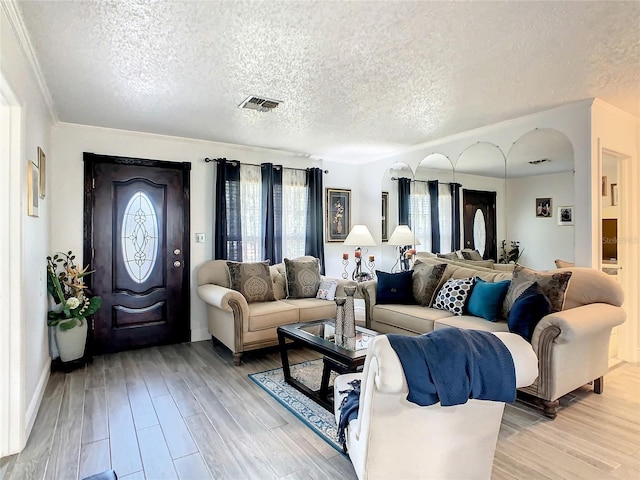 624 Royal Palm Dr, Kissimmee, FL 34743 - living room with a textured ceiling and light wood-type flooring