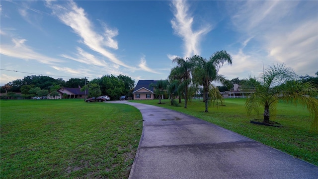 2851 Granada Blvd, Kissimmee, FL 34746 - surrounding community with asphalt driveway and a yard