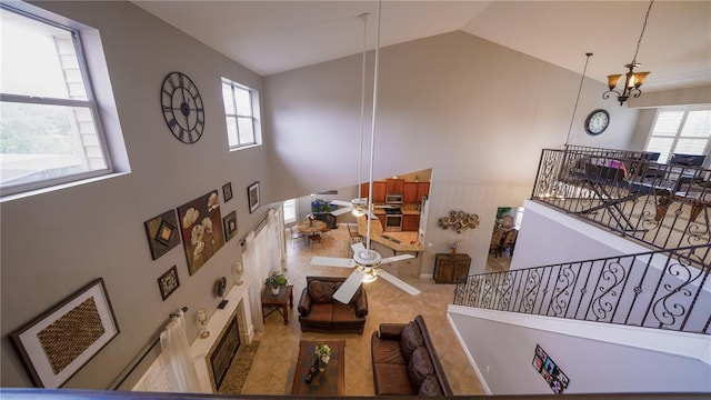 2851 Granada Blvd, Kissimmee, FL 34746 - tiled living room featuring high vaulted ceiling