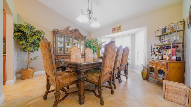 2851 Granada Blvd, Kissimmee, FL 34746 - dining area featuring light tile patterned floors and a chandelier