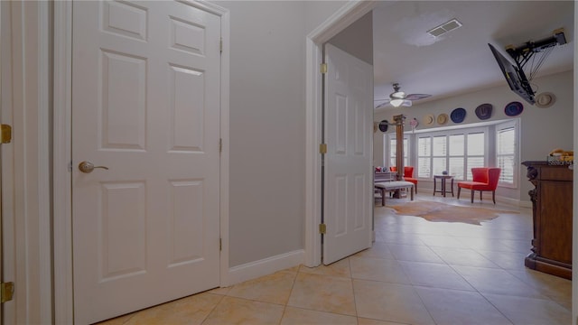 2851 Granada Blvd, Kissimmee, FL 34746 - hallway with light tile patterned flooring and baseboards