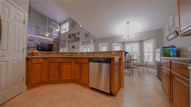 2851 Granada Blvd, Kissimmee, FL 34746 - kitchen featuring stainless steel dishwasher, brown cabinets, a chandelier, plenty of natural light, and a high ceiling
