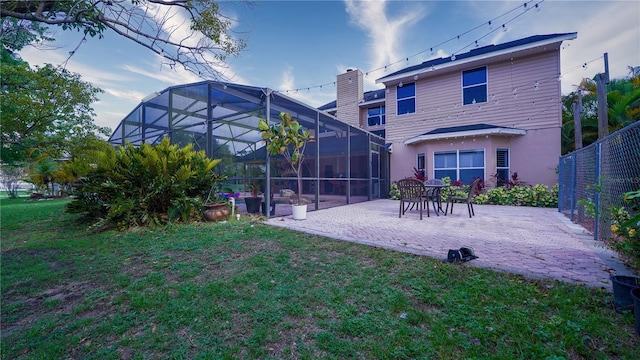 2851 Granada Blvd, Kissimmee, FL 34746 - back of house with a patio, stucco siding, and glass enclosure