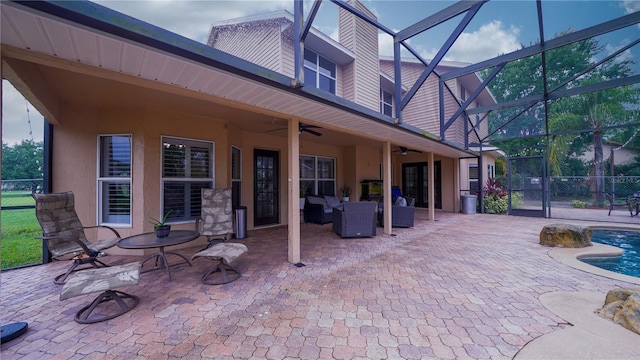 2851 Granada Blvd, Kissimmee, FL 34746 - view of patio / terrace with a ceiling fan, an outdoor hangout area, and glass enclosure