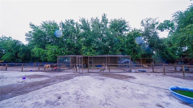2851 Granada Blvd, Kissimmee, FL 34746 - view of property's community featuring view of wooded area and an exterior structure