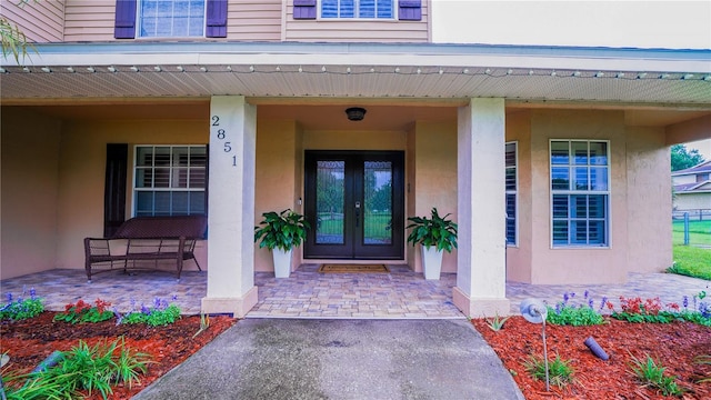 2851 Granada Blvd, Kissimmee, FL 34746 - view of exterior entry featuring french doors and stucco siding