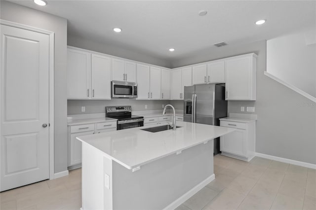 555 Summit River Dr, Apopka, FL 32712 - kitchen with stainless steel appliances, a sink, white cabinets, and recessed lighting