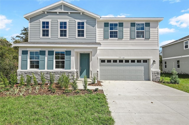 565 Summit River Dr, Apopka, FL 32712 - view of front of house featuring an attached garage, driveway, stone siding, and a front yard