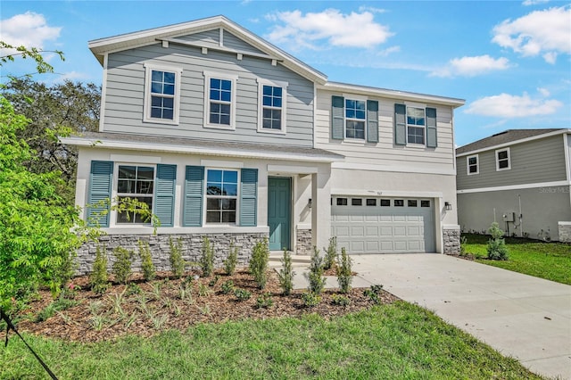 565 Summit River Dr, Apopka, FL 32712 - view of front facade with stone siding, an attached garage, driveway, and a front yard
