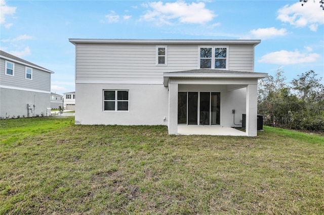 565 Summit River Dr, Apopka, FL 32712 - back of property with a patio area, central air condition unit, a lawn, and stucco siding
