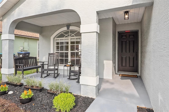 2700 Palm Isle Way, Orlando, FL 32829 - entrance to property featuring a porch and stucco siding