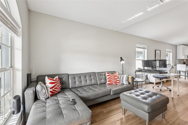 2700 Palm Isle Way, Orlando, FL 32829 - living room featuring light wood finished floors, lofted ceiling, and a desk