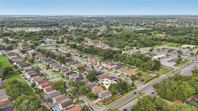 2700 Palm Isle Way, Orlando, FL 32829 - aerial overview of property's location with a tree filled landscape and nearby suburban area