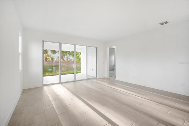 9127 Players Dr, Weeki Wachee, FL 34613 - spare room with light wood finished floors