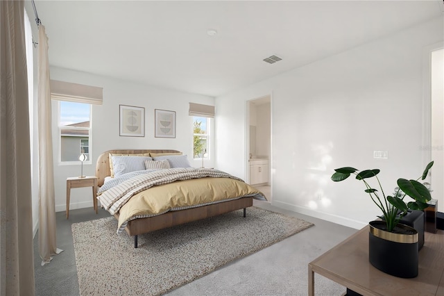 9127 Players Dr, Weeki Wachee, FL 34613 - bedroom with baseboards and ensuite bath