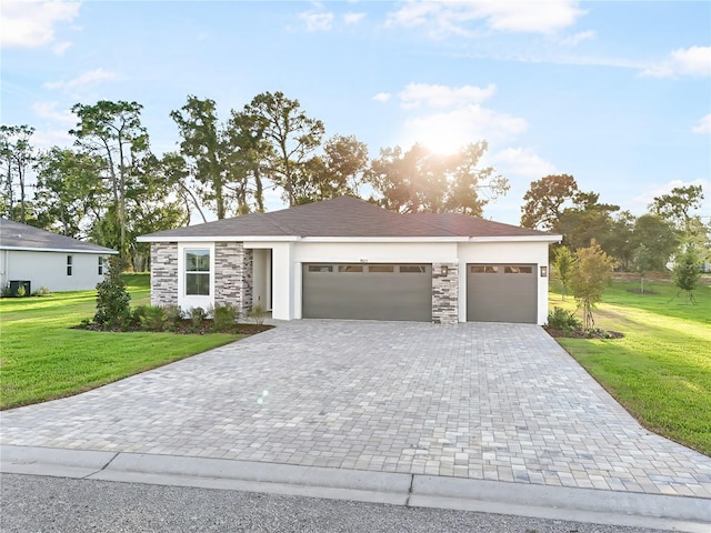9127 Players Dr, Weeki Wachee, FL 34613 - view of front of property with stone siding, a garage, decorative driveway, and a front lawn