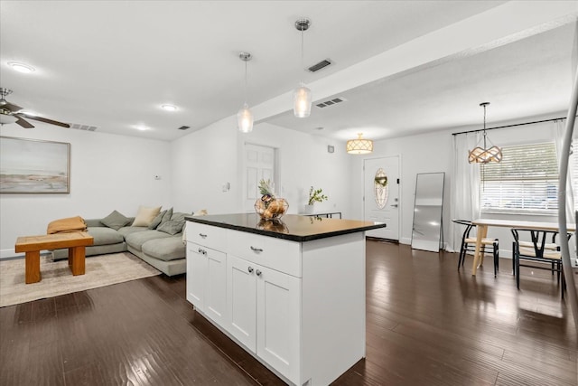 736 Forest Glen Ct, Maitland, FL 32751 - kitchen featuring dark countertops, white cabinetry, a kitchen island, dark wood-type flooring, and a ceiling fan