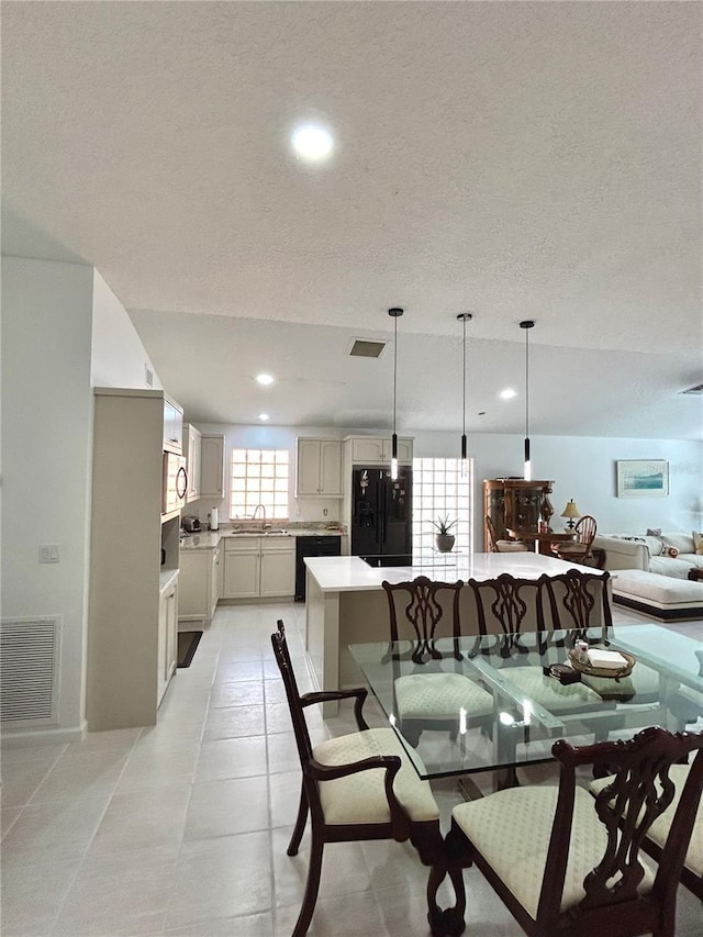 1084 Aspri Way, Riviera Beach, FL 33418 - dining space featuring a textured ceiling, recessed lighting, and light tile patterned flooring