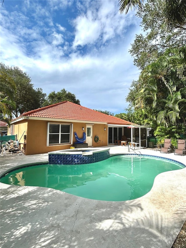 1084 Aspri Way, Riviera Beach, FL 33418 - view of pool featuring a patio and a pool with connected hot tub