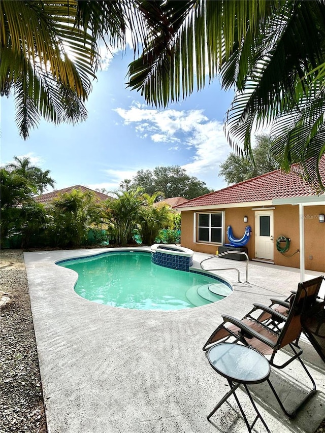1084 Aspri Way, Riviera Beach, FL 33418 - view of pool featuring a patio and a pool with connected hot tub
