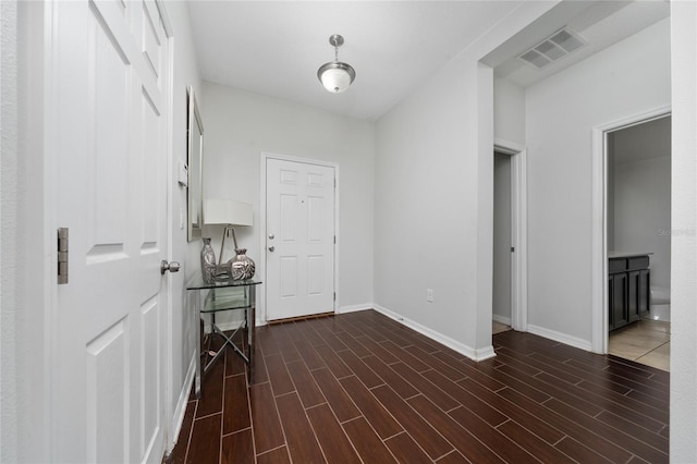 205 Lakeshore Dr, Davenport, FL 33837 - foyer entrance featuring baseboards and dark wood finished floors