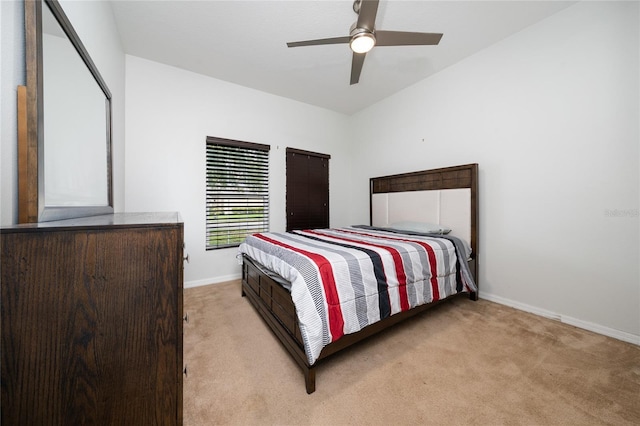 205 Lakeshore Dr, Davenport, FL 33837 - bedroom with light colored carpet, baseboards, and ceiling fan