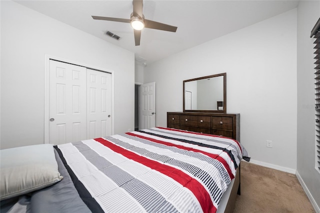 205 Lakeshore Dr, Davenport, FL 33837 - bedroom featuring carpet floors, a closet, baseboards, and a ceiling fan