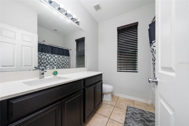 205 Lakeshore Dr, Davenport, FL 33837 - bathroom with vanity, toilet, tile patterned flooring, and a shower with shower curtain
