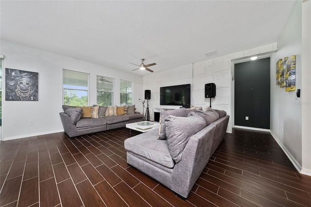 205 Lakeshore Dr, Davenport, FL 33837 - living room with a ceiling fan, dark wood finished floors, baseboards, and vaulted ceiling