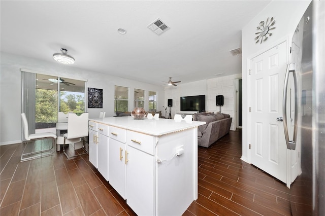 205 Lakeshore Dr, Davenport, FL 33837 - kitchen featuring ceiling fan, freestanding refrigerator, a center island, and light countertops