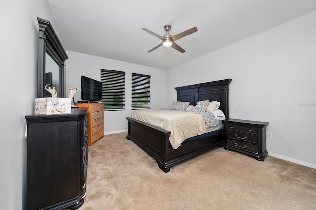 205 Lakeshore Dr, Davenport, FL 33837 - bedroom with light colored carpet, baseboards, and a ceiling fan