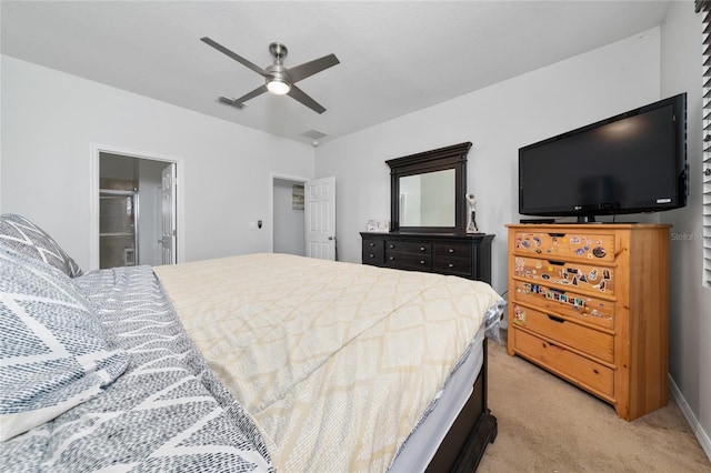 205 Lakeshore Dr, Davenport, FL 33837 - bedroom featuring light colored carpet, a ceiling fan, ensuite bath, and baseboards