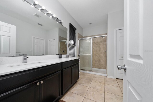 205 Lakeshore Dr, Davenport, FL 33837 - full bath featuring double vanity, a stall shower, and tile patterned floors