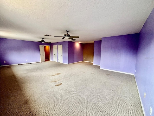 4368 Fox Glen Loop, Kissimmee, FL 34746 - empty room with ceiling fan, baseboards, a textured ceiling, and carpet flooring