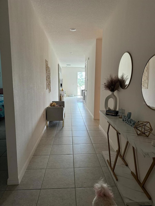 522 Feltrim Manor Rd, Haines City, FL 33844 - hall with a textured ceiling and tile patterned floors