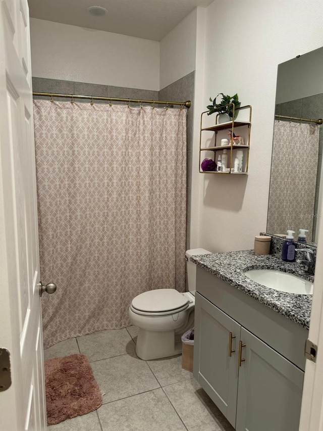 522 Feltrim Manor Rd, Haines City, FL 33844 - bathroom with vanity, toilet, and tile patterned flooring