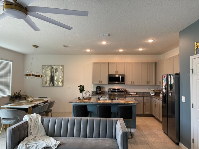 522 Feltrim Manor Rd, Haines City, FL 33844 - kitchen featuring stainless steel appliances, light tile patterned floors, recessed lighting, a textured ceiling, and a ceiling fan