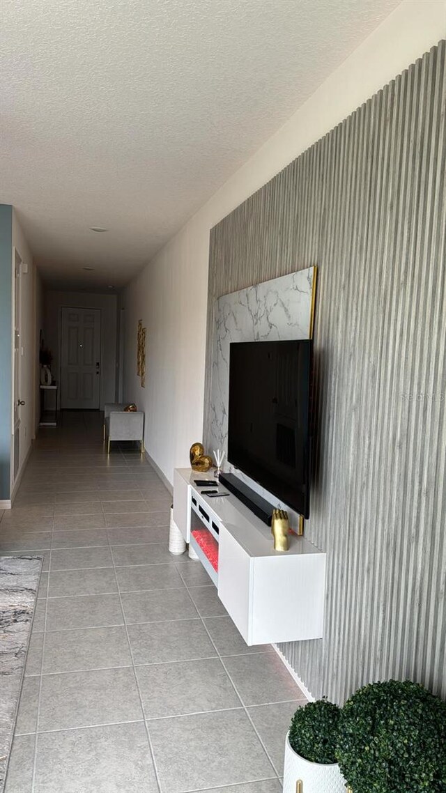 522 Feltrim Manor Rd, Haines City, FL 33844 - hallway with a textured ceiling, tile patterned floors, and baseboards