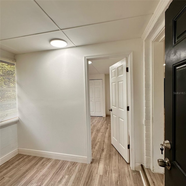1615 NE 9th St, Ocala, FL 34470 - hallway featuring light wood finished floors and baseboards