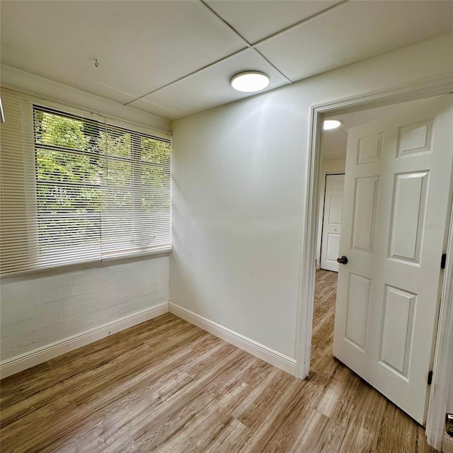 1615 NE 9th St, Ocala, FL 34470 - unfurnished room featuring baseboards and light wood-type flooring