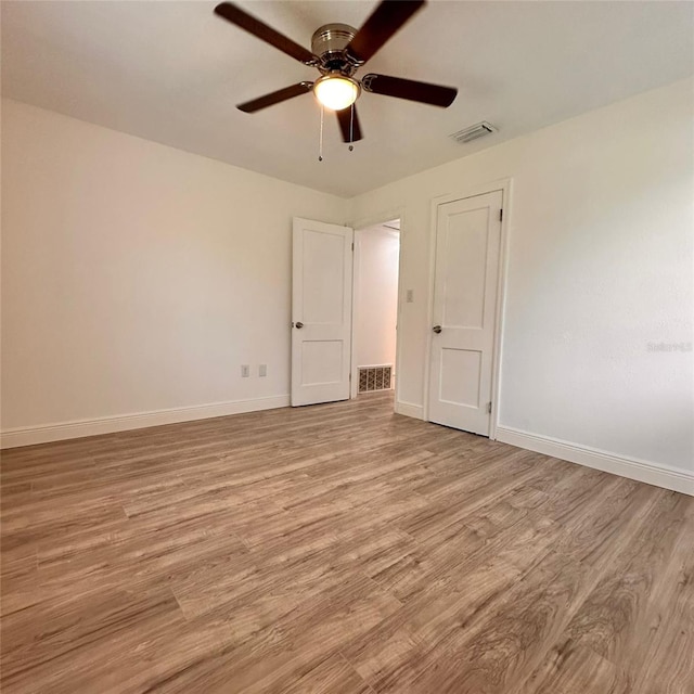1615 NE 9th St, Ocala, FL 34470 - unfurnished bedroom featuring light wood finished floors, baseboards, and ceiling fan