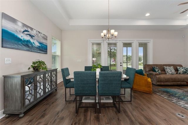 1598 Whitewood Ct, Kissimmee, FL 34747 - dining space featuring dark wood finished floors, a chandelier, a raised ceiling, baseboards, and recessed lighting