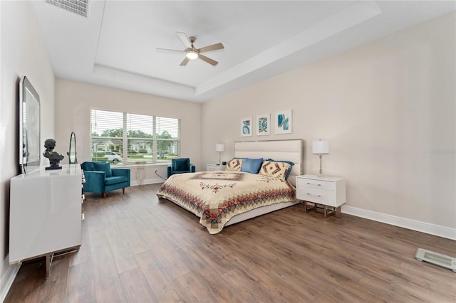 1598 Whitewood Ct, Kissimmee, FL 34747 - bedroom with a raised ceiling, wood finished floors, baseboards, and a ceiling fan